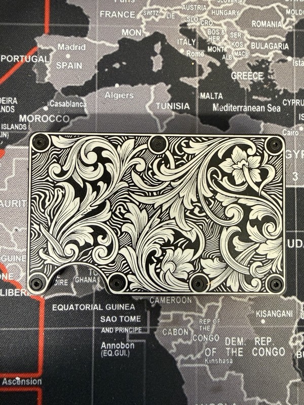 Engraved In USA, scroll work with Damascus pattern